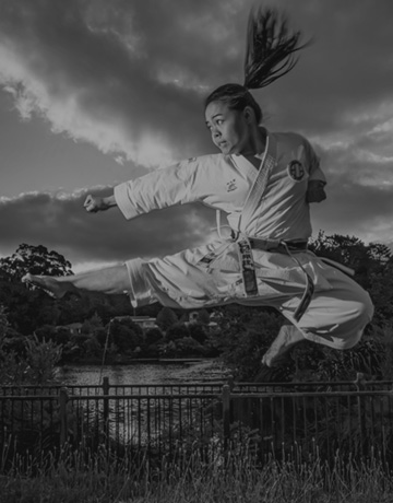 Andrea Anacan performing a flying kick