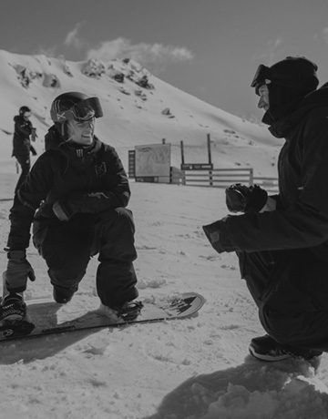 Zoi and coach on the slopes